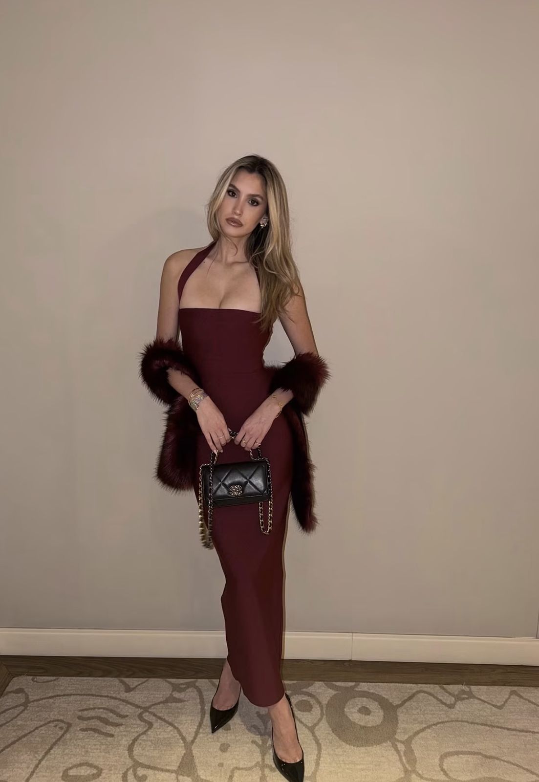 Burgundy halter column dress with fur stole